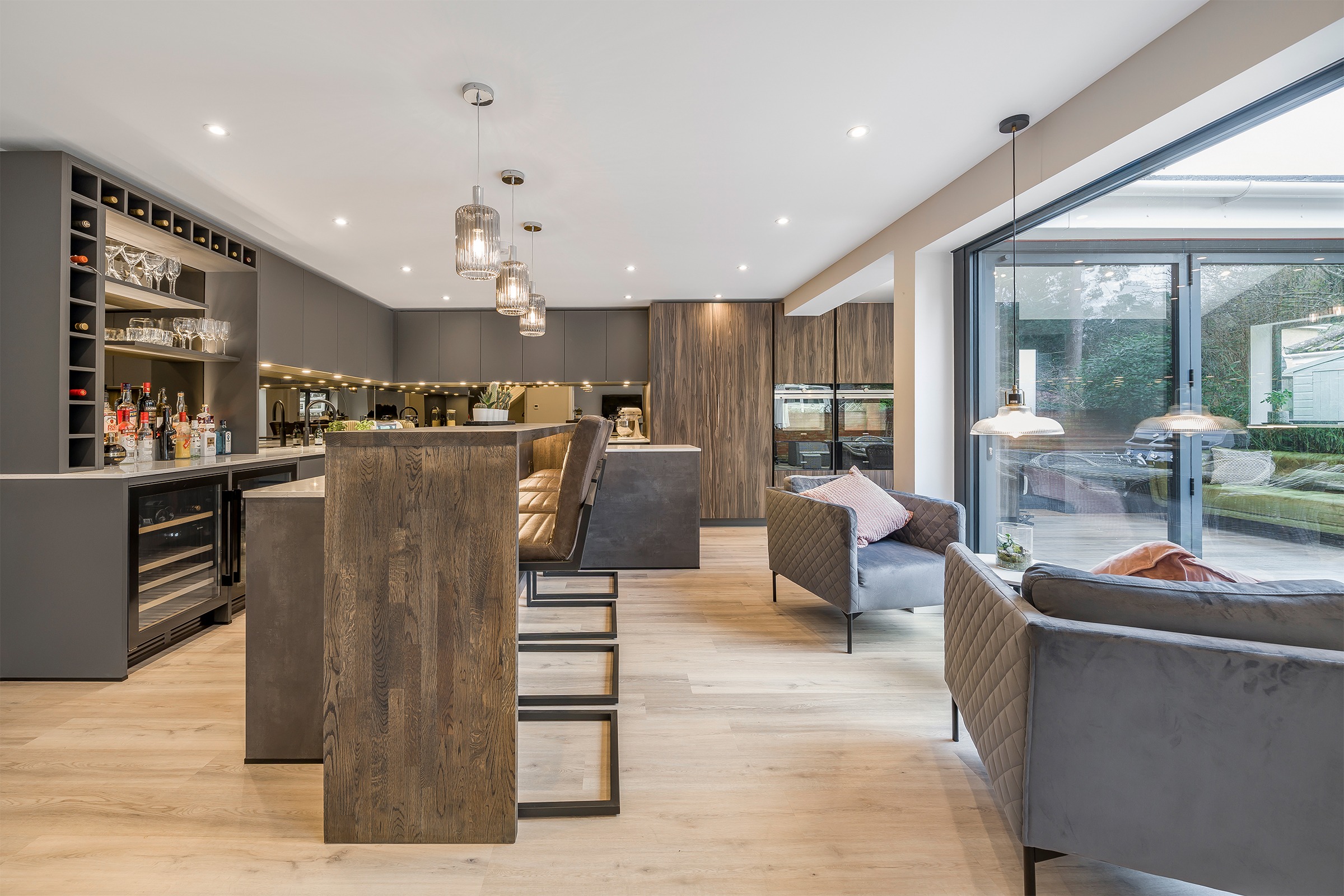 moody grey kitchen with home drinks bar