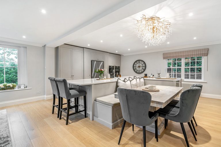 Shaker kitchen with banquette seating island.