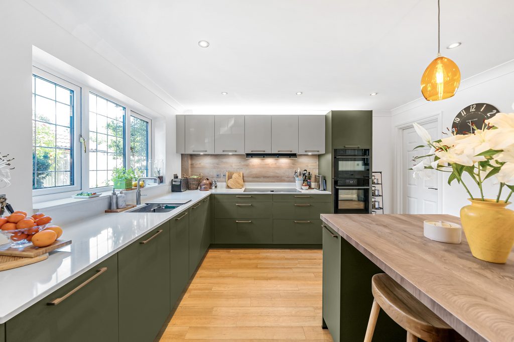A two-toned modern kitchen with breakfast bar and Neff appliances