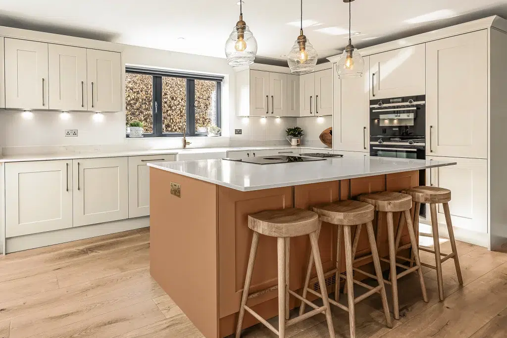 A bold kitchen island reflecting the trending spice tones for kitchen design in 2026.