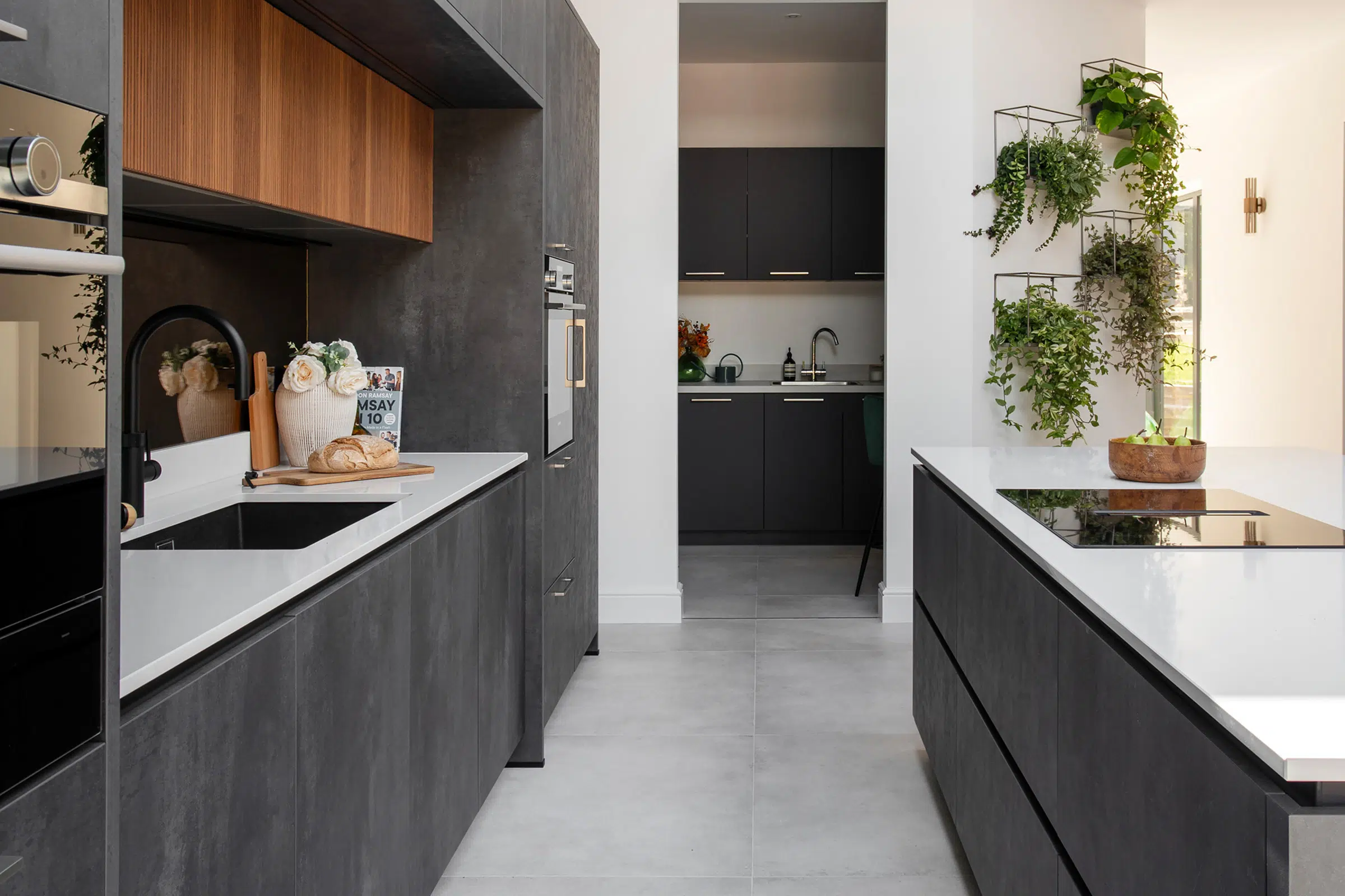 An elegant modern kitchen with complementary spice kitchen.