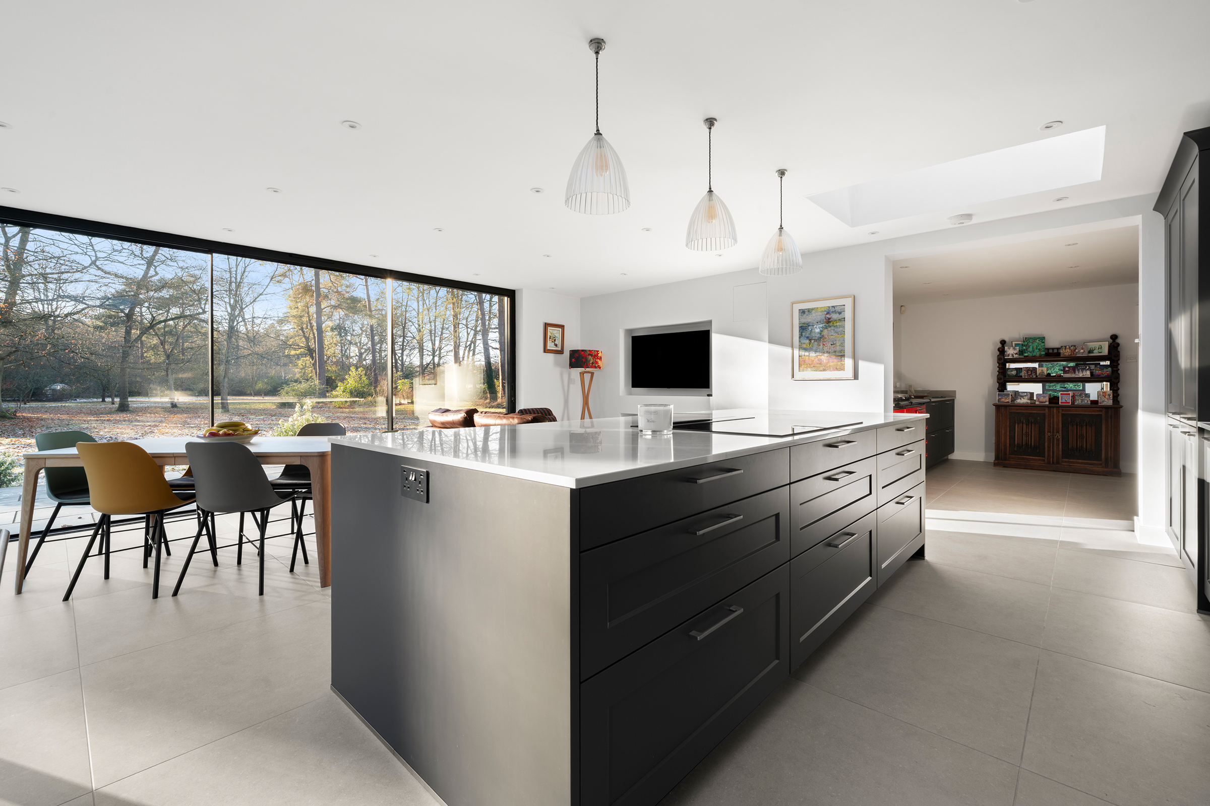 A stunning modern shaker design large bi-folds that connect to the garden space.