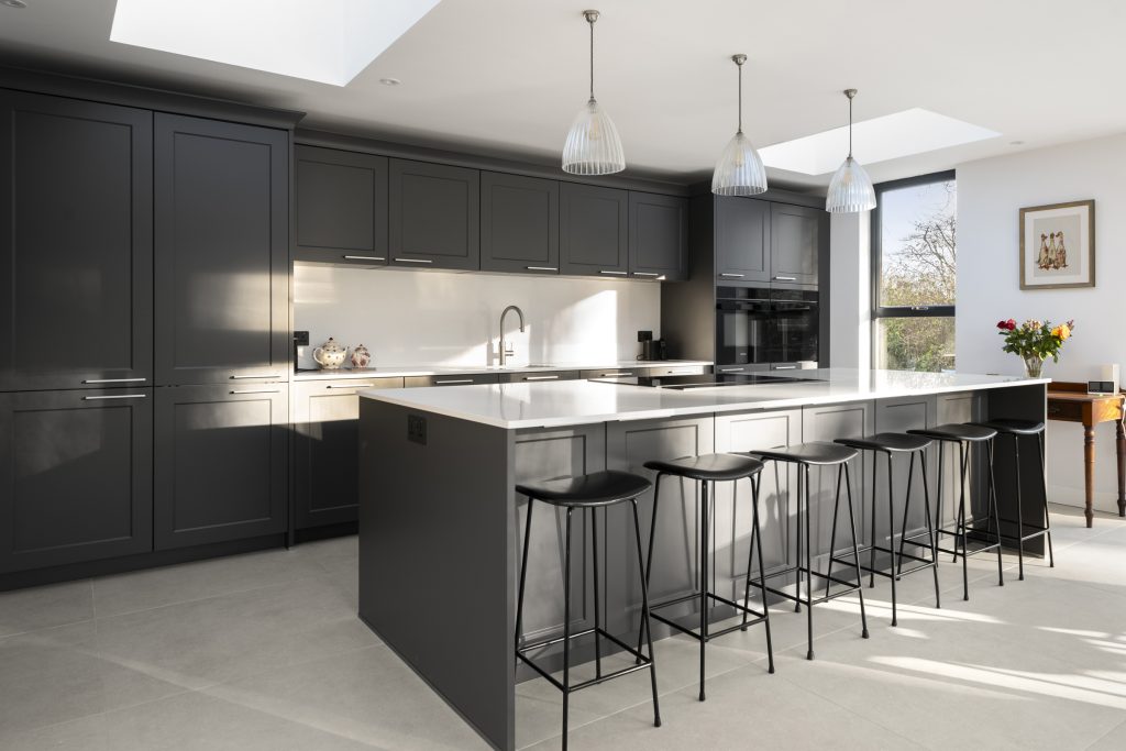 A dark grey modern shaker kitchen in Systemat furniture by KCA.