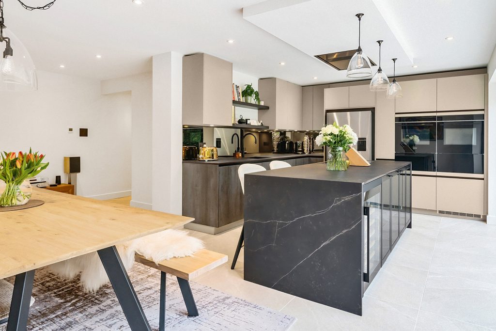 A modern warm neutral kitchen design by KCA
