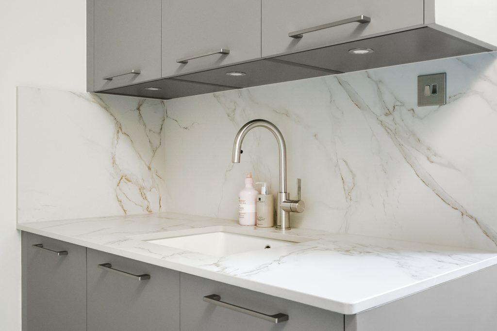 Utility room sink area with hardwearing materials.