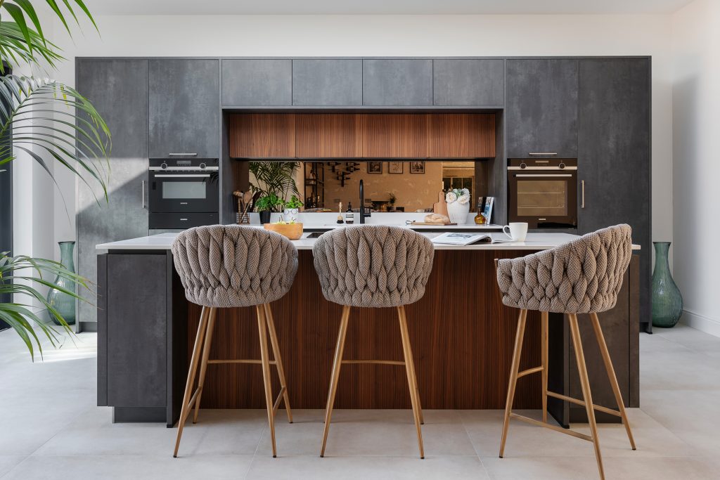 A Modern walnut and putty concrete Hacker Systemat kitchen by KCA
