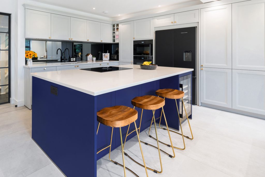 An electric blue shaker kitchen island. Hacker furniture by KCA.