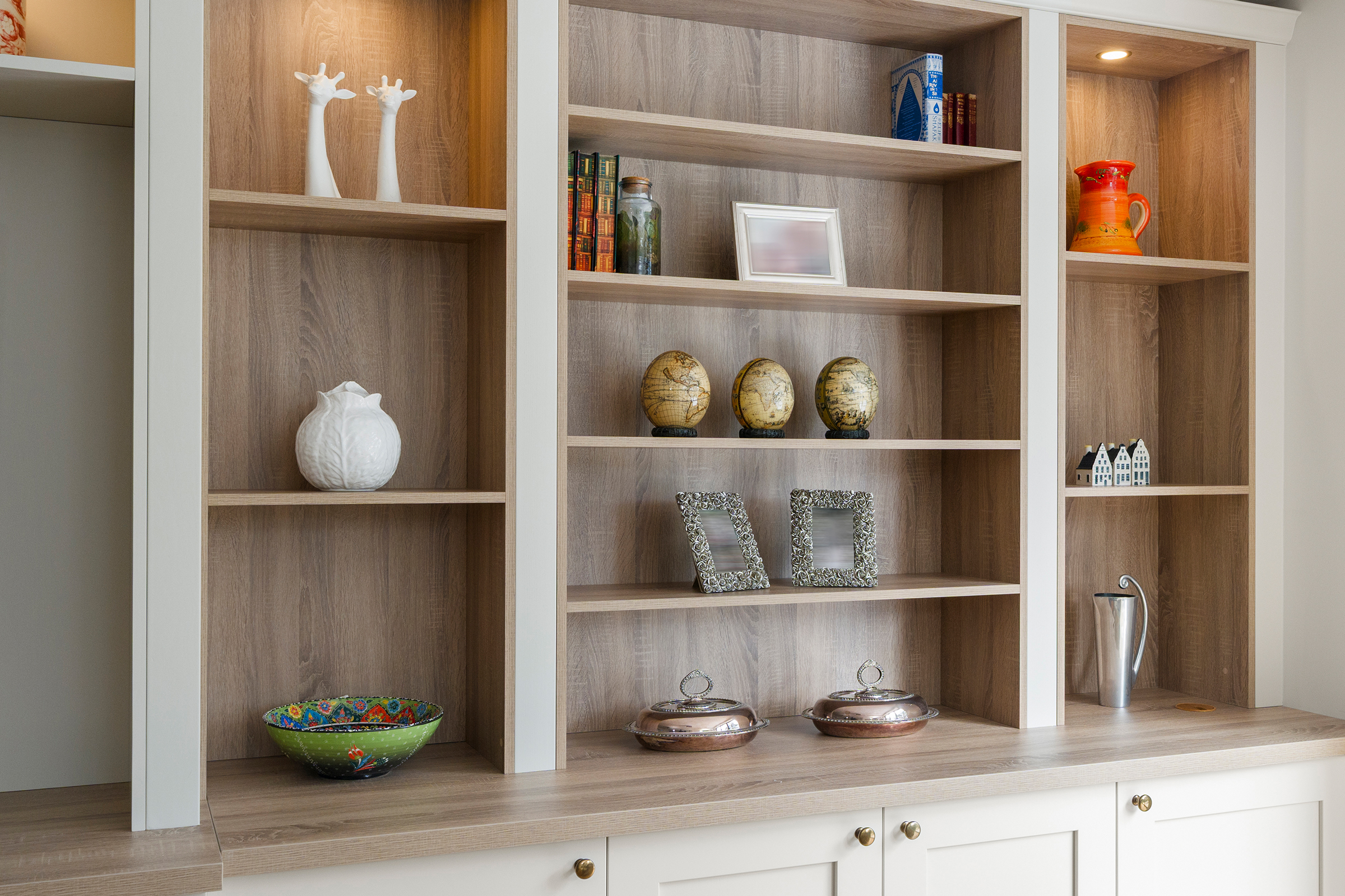 Bookcase and storage in a shaker fitted media unit.