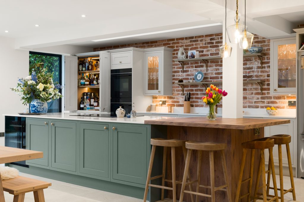 A Shaker Kitchen-with Prep-Pantry Breakfast Bar Seating and Bootility Space in green.