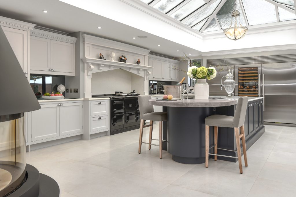 Luxury handcrafted Davonport kitchen with traditional shaker detailing and curved breakfast island.