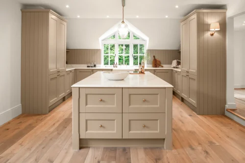 Hamptons style shaker kitchen with warm neutrals.